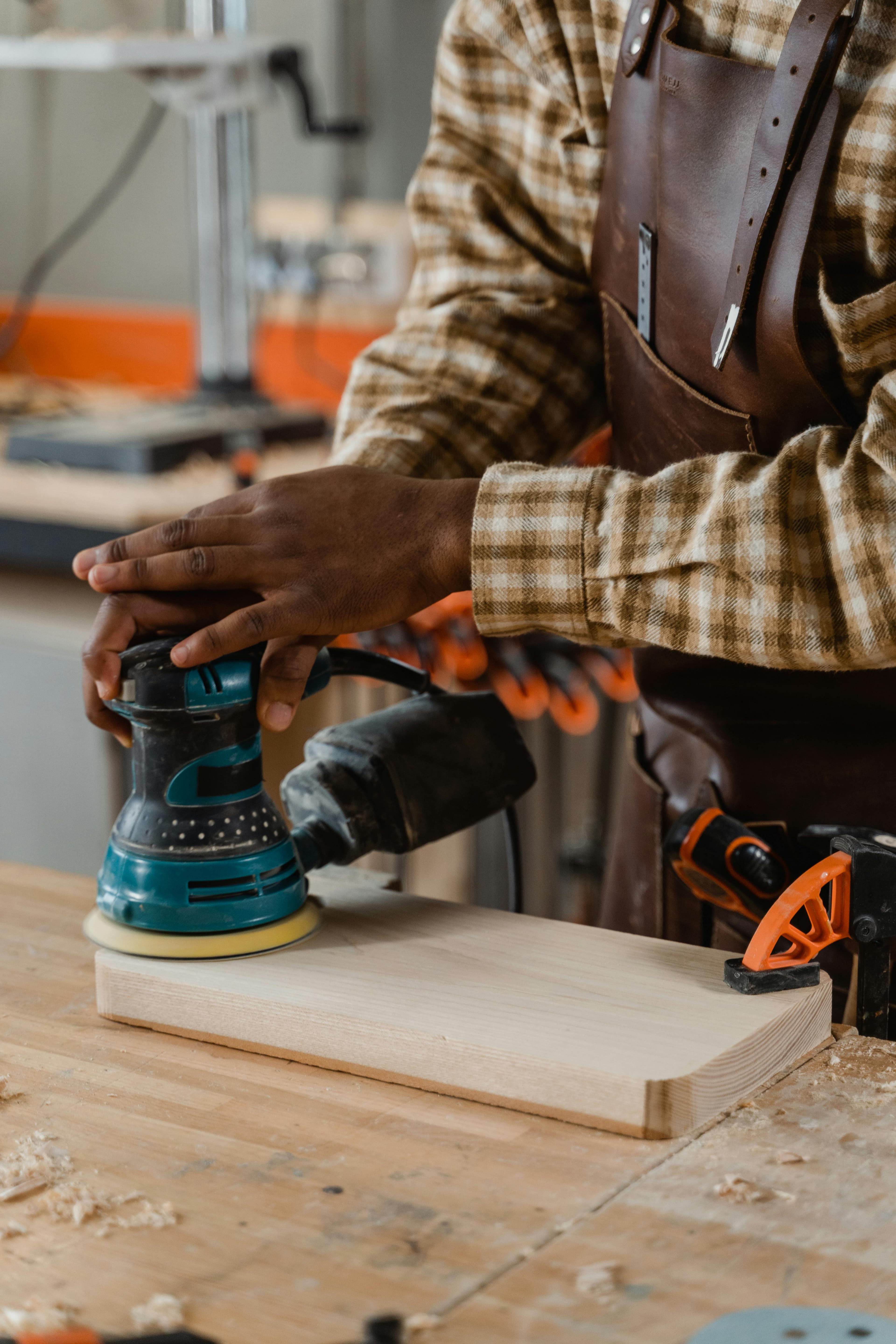 Handyman sanding and crafting custom woodwork